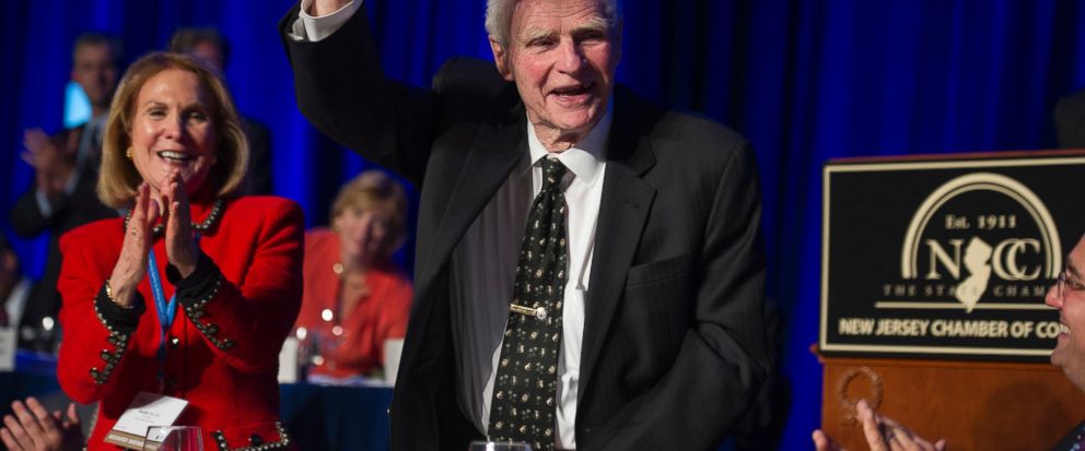 FILE – In this April 22, 2014, file photo, former New Jersey Gov. Brendan Byrne waves as the audience sings him "Happy Birthday" and his wife Ruthi Zinn Byrne applauds, to mark his 90th birthday during the annual "Congressional Dinner" of the New Jersey State Chamber of Commerce in Washington, D.C. A ceremony at Healy’s Tavern in Jersey City on Friday, March 16, 2018, will honor Byrne, who died in January at age 93. Byrne used to joke he wanted his ashes placed in Hudson County, known for its history of political shenanigans, so he could stay active in politics. (AP Photo/Cliff Owen, File)